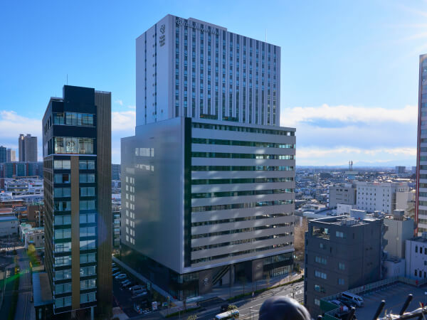 地価上昇という環境変化を背景に、平面駐車場から大型複合ビルへ